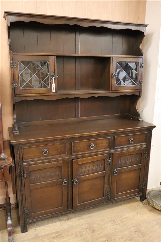 A modern panelled oak dresser W.137cm